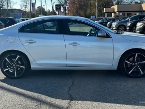 The 2015 Volvo S60 T6 R showcases a sleek, dynamic design with a bold, athletic stance, emphasizing luxury and performance.