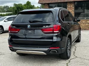 A sleek 2018 BMW X5 showcasing its premium design, elegant contours, and dynamic stance, highlighting its luxury and performance.