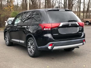 The 2018 Mitsubishi Outlander ES 4dr SUV showcasing its sleek design, spacious interior, and modern features, perfect for family adventures.