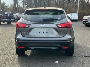 A 2019 Nissan Rogue Sport S AWD 4dr Crossover in a dynamic setting, showcasing its sleek design, advanced features, and modern appeal.