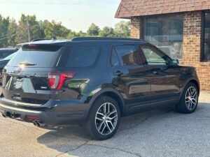 2018 Ford Explorer showcasing key features: spacious interior, advanced safety technology, powerful engine, and sleek exterior design.