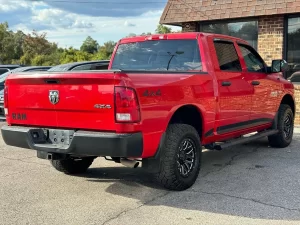 2016 RAM 1500 Express showcasing its robust design and bold style in a scenic outdoor setting.