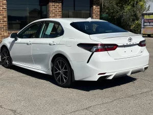 2021 Toyota Camry SE in a sleek design, showcasing its modern styling and bold appearance.