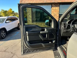 2020 Ford F-150 driving on a rugged road, showcasing its powerful performance and sleek design.