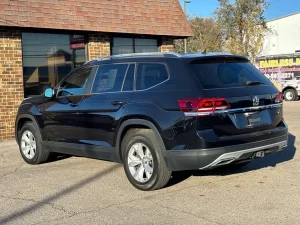 2019 Volkswagen Atlas parked in a scenic outdoor setting, showcasing its spacious design and modern features.