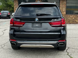 A sleek 2018 BMW X5 showcasing its premium design, elegant contours, and dynamic stance, highlighting its luxury and performance.