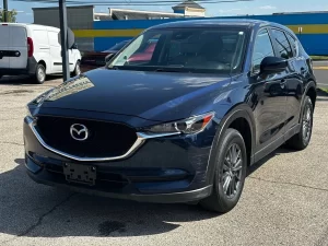 The 2017 Mazda CX-5 Touring AWD SUV showcases its sleek design, refined interior, and advanced features for a smooth driving experience.