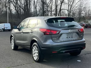 A 2019 Nissan Rogue Sport S AWD 4dr Crossover in a dynamic setting, showcasing its sleek design, advanced features, and modern appeal.