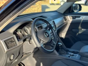 2019 Volkswagen Atlas parked in a scenic outdoor setting, showcasing its spacious design and modern features.