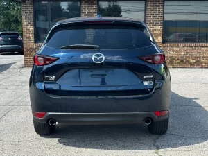 The 2017 Mazda CX-5 Touring AWD SUV showcases its sleek design, refined interior, and advanced features for a smooth driving experience.