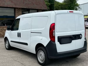 2021 RAM ProMaster City Tradesman parked outdoors, showcasing its sleek design and compact build for versatile business use.