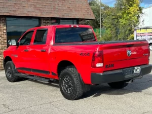 2016 RAM 1500 Express showcasing its robust design and bold style in a scenic outdoor setting.