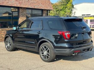 2018 Ford Explorer showcasing key features: spacious interior, advanced safety technology, powerful engine, and sleek exterior design.