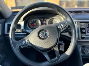 2019 Volkswagen Atlas parked in a scenic outdoor setting, showcasing its spacious design and modern features.