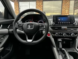 A sleek 2018 Honda Accord LX showcasing its modern design and premium features in a dynamic setting.