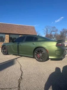 The 2022 Dodge Charger in a striking outdoor setting, highlighting its bold design, sleek lines, and powerful presence.