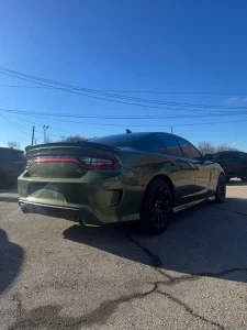 The 2022 Dodge Charger in a striking outdoor setting, highlighting its bold design, sleek lines, and powerful presence.